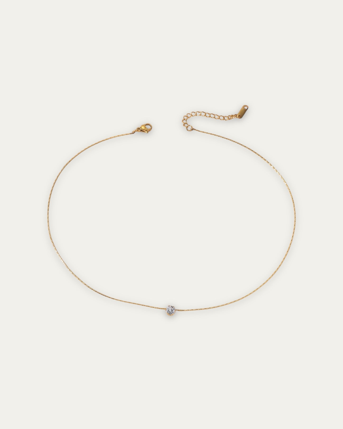 Colgante mini circonita en acero baño oro 18K Solitaro