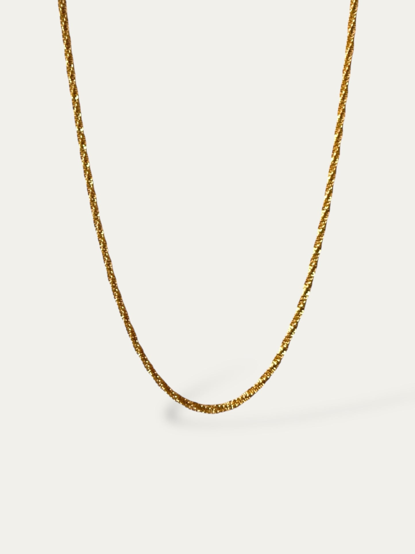 Cadena rizada en acero baño oro 18K