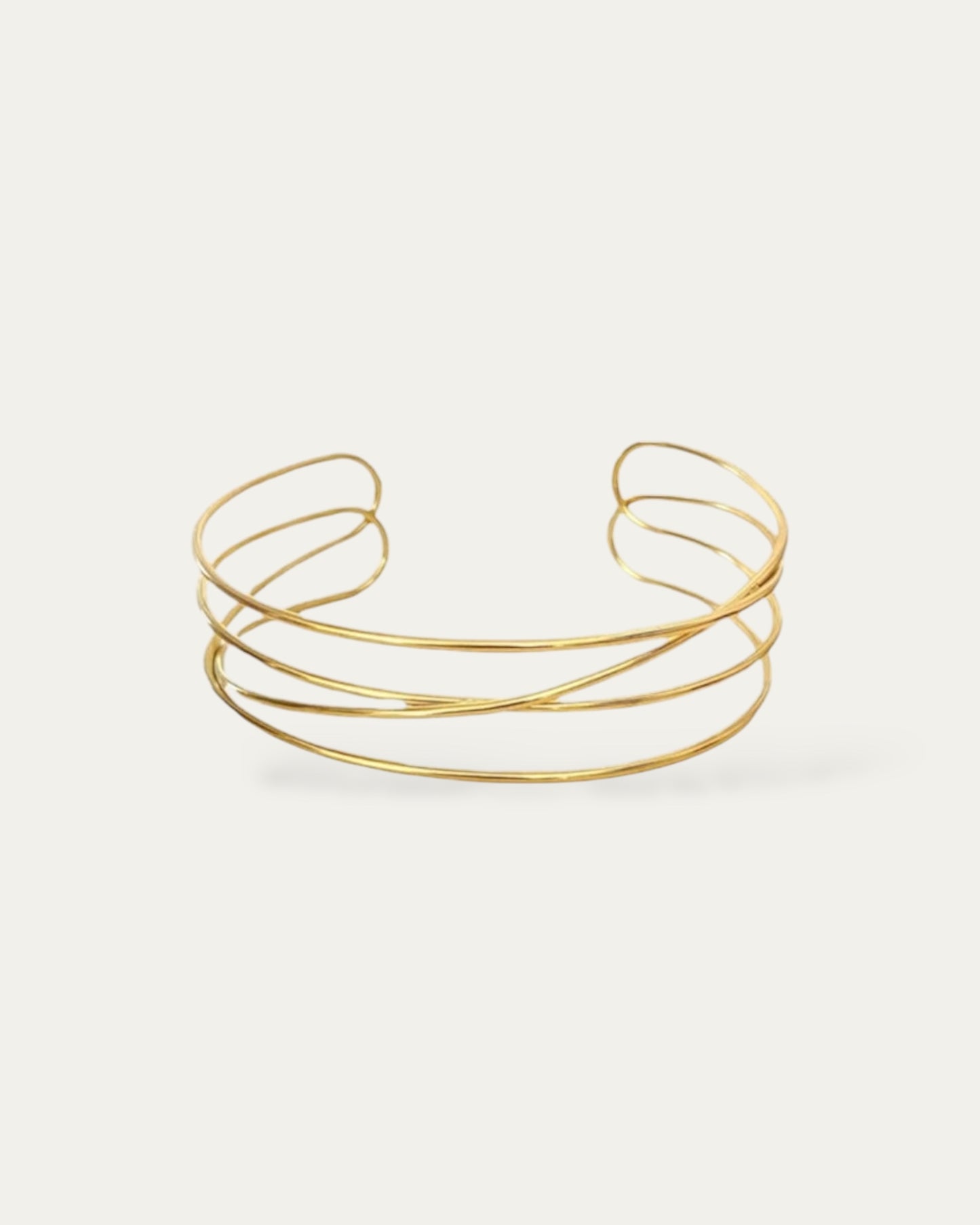 Gargantilla rígida estilo choker de bandas cruzadas en acero baño oro Lía