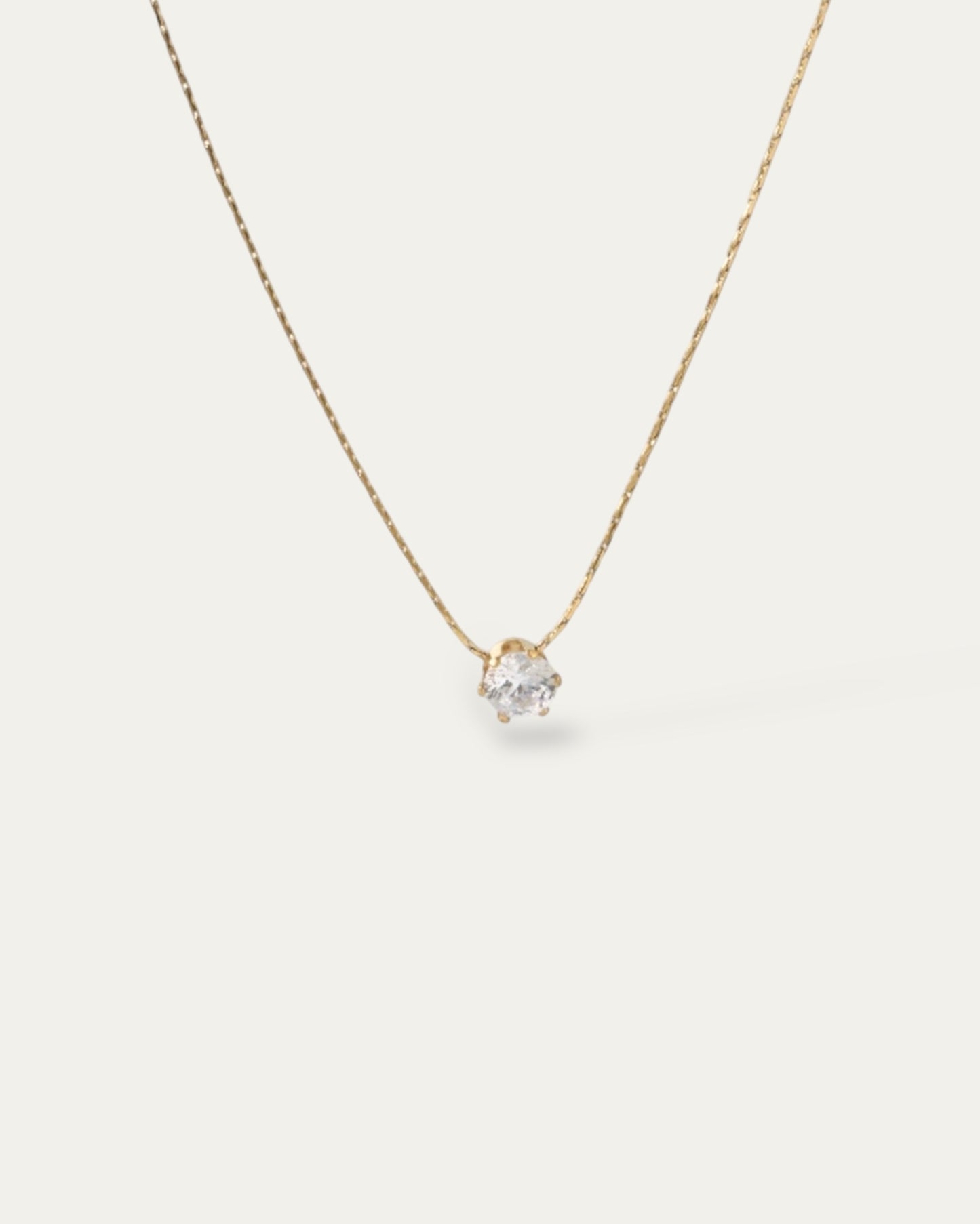 Colgante mini circonita en acero baño oro 18K Solitaro