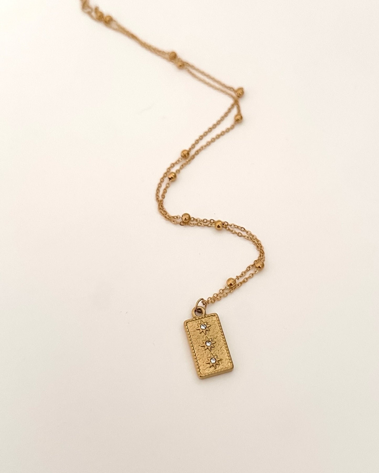 Collar cadena bolitas con colgante rectangular textura con circonitas acabado oro mate 18 K Via