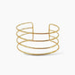 Brazalete ajustable bandas en acero inoxidable con baño de oro 18K  Quatro