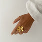 Anillo flor ajustable con circonita en acero baño oro 18K June