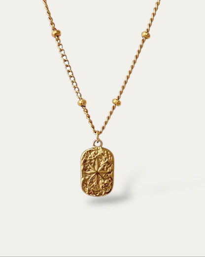 Collar con cadena de bolitas y colgante textura estrella en acero acabado oro Estrella De Oriente