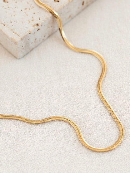 Cadena plana 3mm en acero baño oro 18K Lisa
