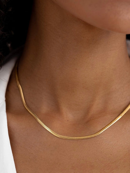 Cadena plana 3mm en acero baño oro 18K Lisa