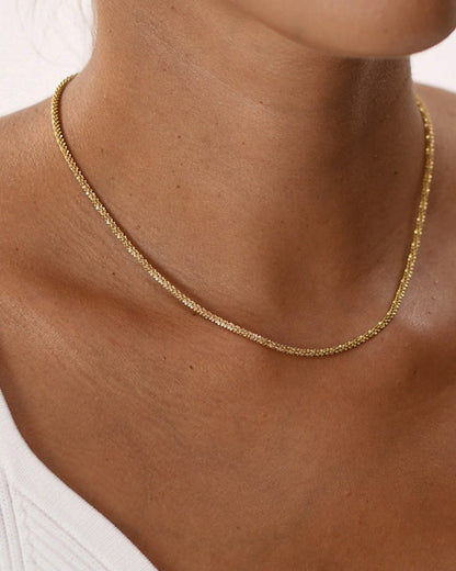 Cadena rizada en acero baño oro 18K