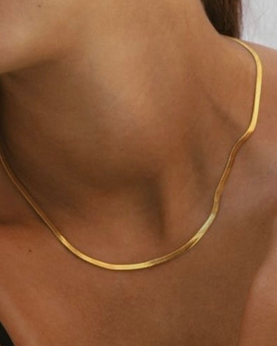 Cadena plana 3mm en acero baño oro 18K Lisa