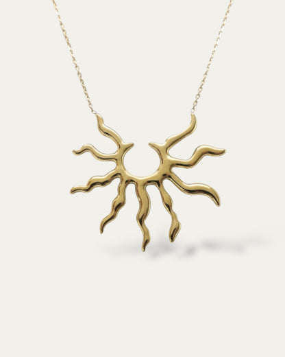 Colgante grande con diseño de rayos de sol en acero baño oro 18K Ra