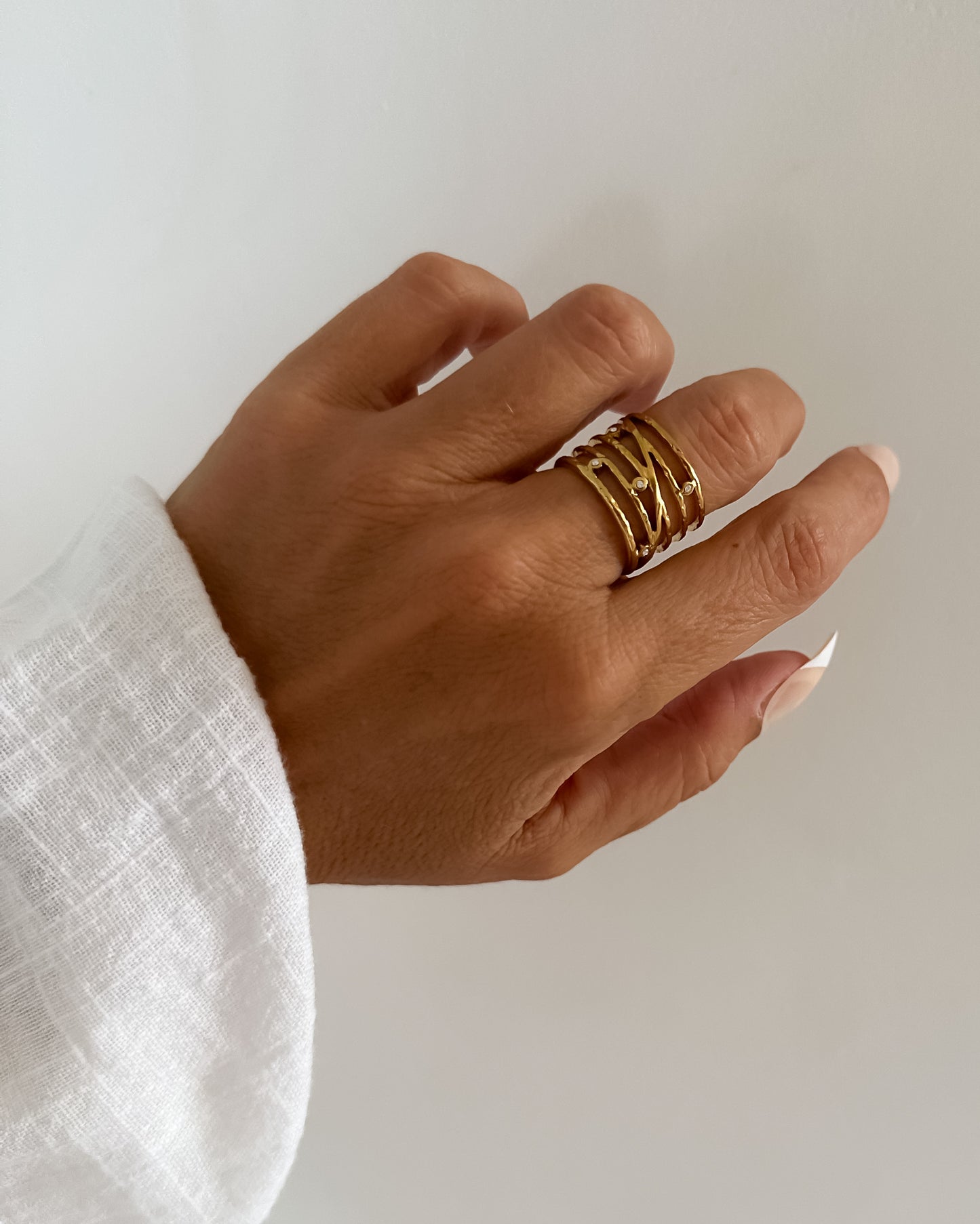 Anillo ajustable bandas con circonitas en acero baño oro 18K Pentagrama