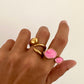 Anillo abertura delantera detalle resina rosa en acero baño oro 18K Pink Cream