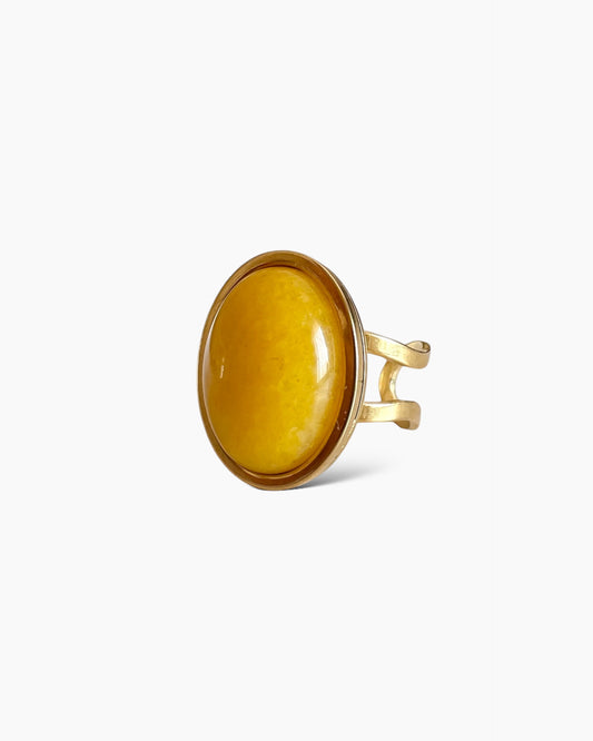 Anillo piedra grande ovalada amarillo oscuro en acero baño oro 18K Mango