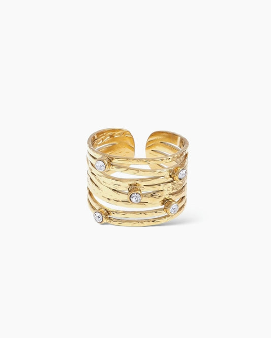 Anillo bandas cruzadas textura y circonitas acero baño oro 18K Paula